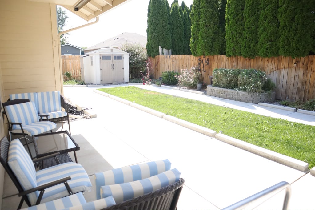 Back patio with striped cushions