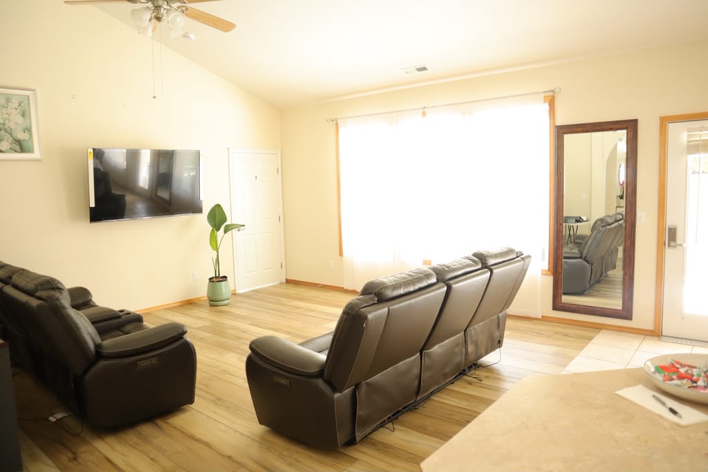 Bright living room with leather recliners