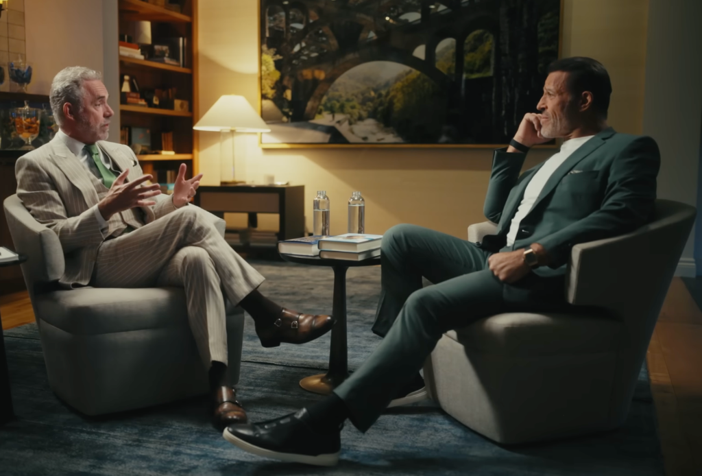 Two men in conversation in a studio setting
