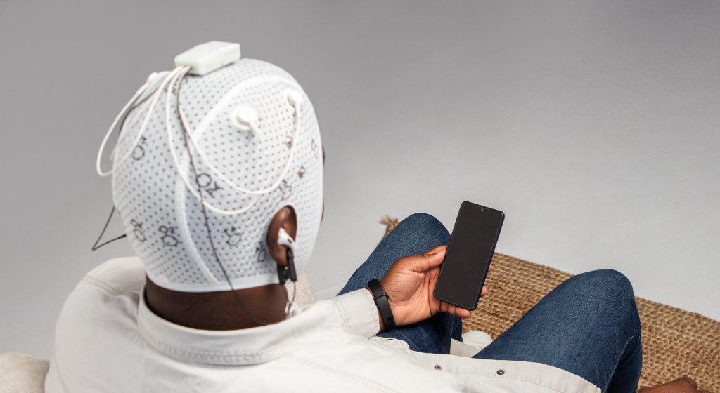 Patient wearing EEG assessment cap