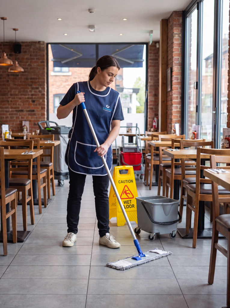 Cynergy cleaner mopping a restaurant floor