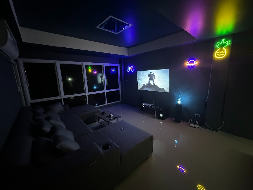 Neon PS5 gaming lounge at Happy High Bangkok cannabis shop