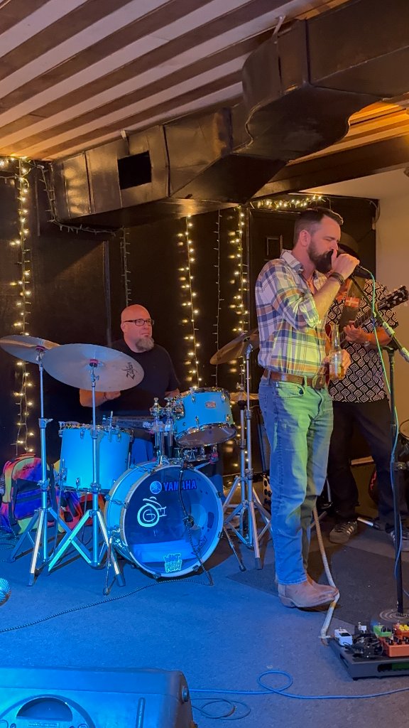 Drummer and singer performing live
