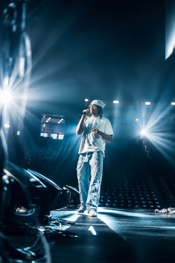 Soul Hemingway on stage with spotlights at the Vines Center Arena