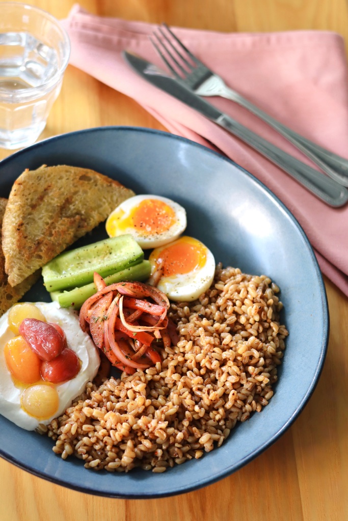 Mediterranean grain bowl with soft-boiled egg