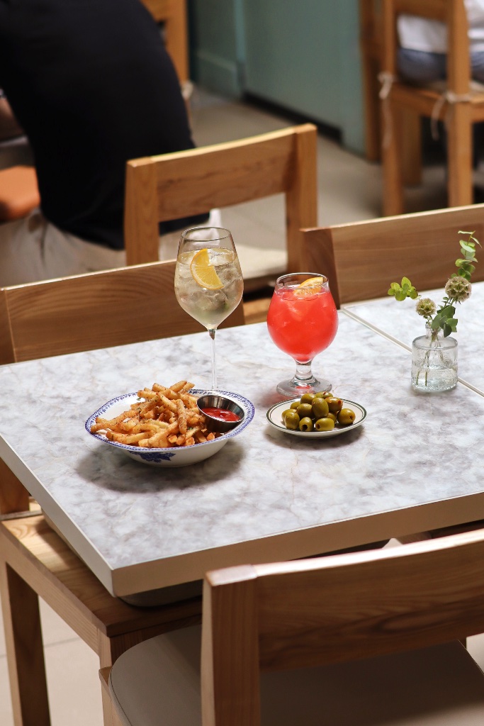 Fries and cocktails on marble table