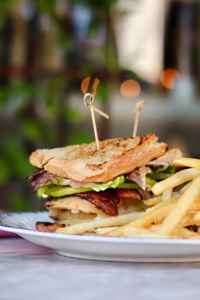 Chicken club sandwich with fries