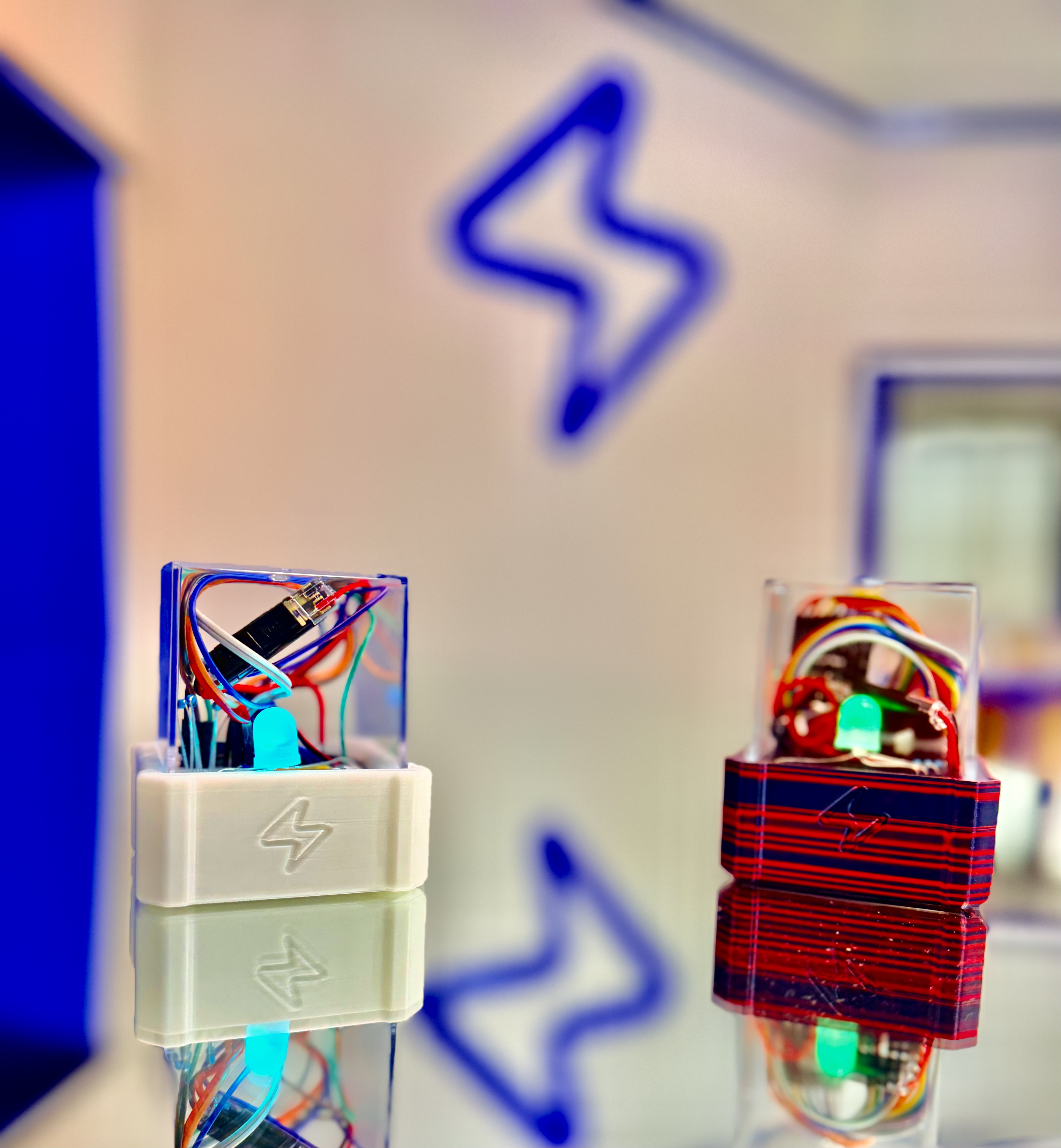 The Pixel — a clear-topped STEM electronics build kit with colorful wiring and a glowing LED, built by kids at ZapLab in Spokane