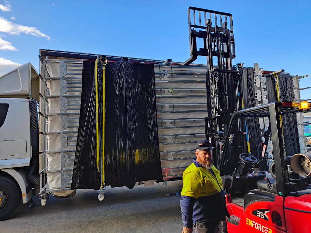 Completed rolling frame being unloaded