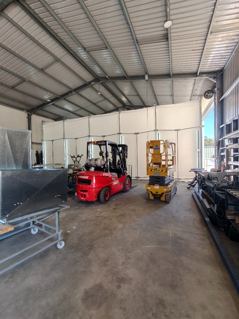 Truck inside the booth — comfortable, large working space
