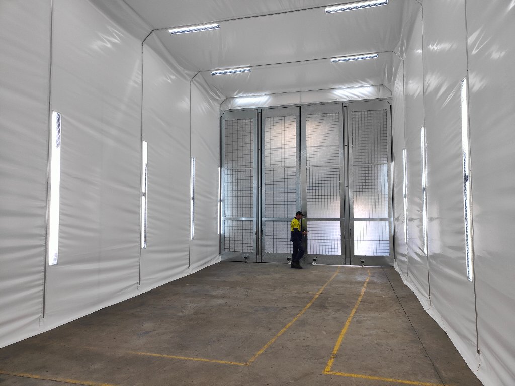 Truck spray booth interior — rear doors