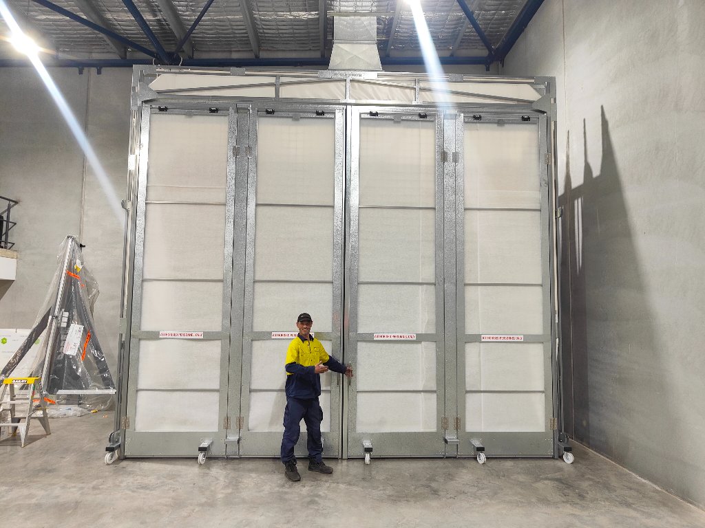 Booth front doors — technician for scale