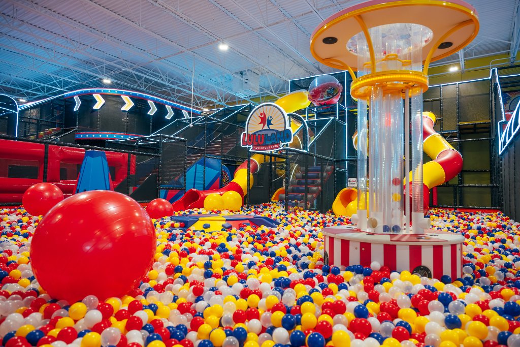Children playing in a massive colorful ball pit at Lululand Adventure Park