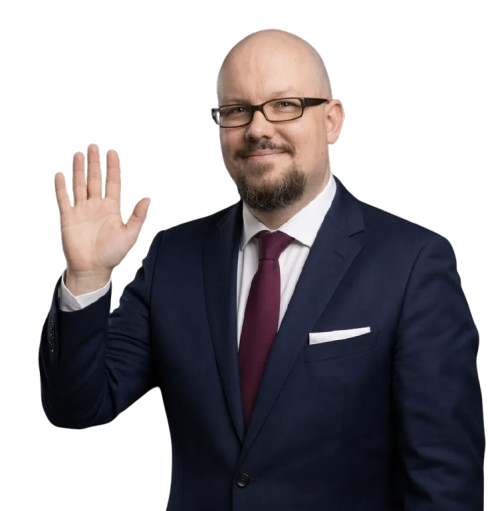 Kay Malek winkt