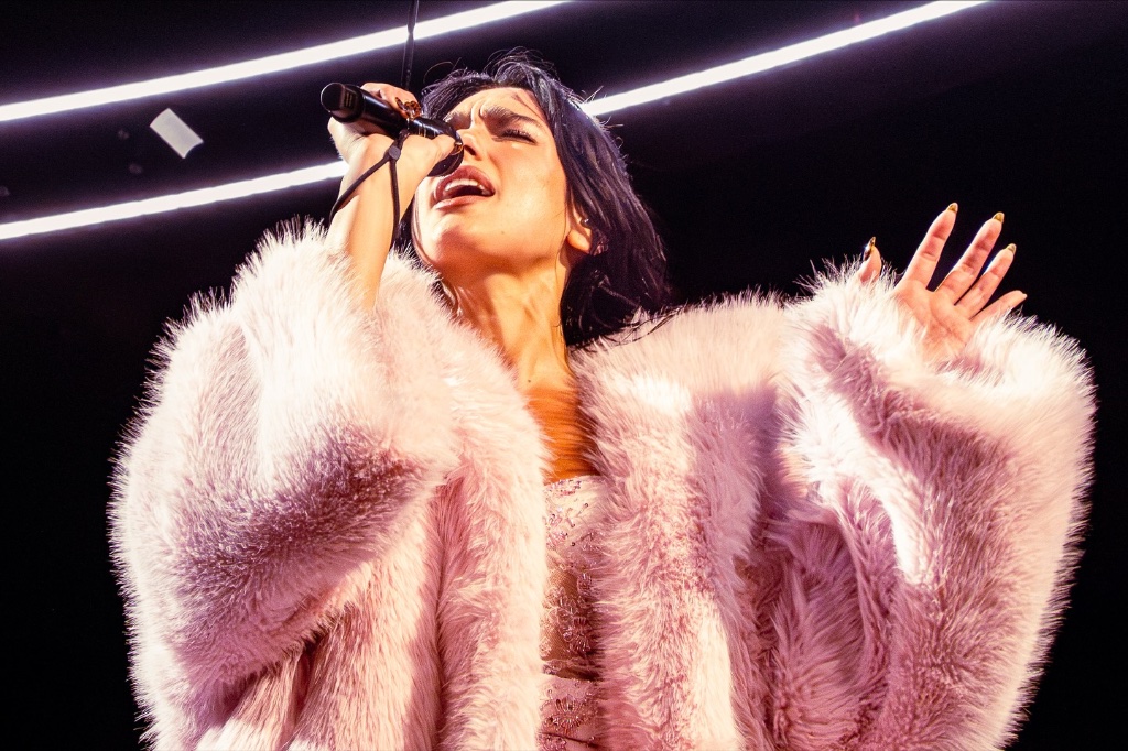 Dua Lipa performing during the The Radical Optimism Tour at Kia Forum in Los Angeles, CA — concert photography by Anthony Cavale for Cavale Live