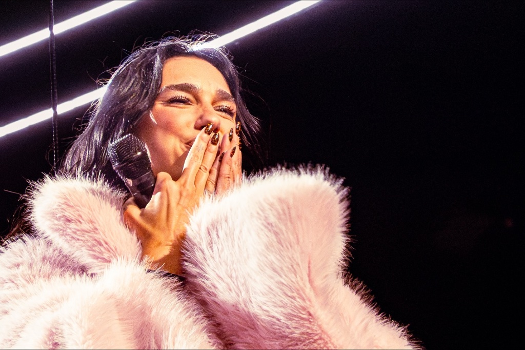 Dua Lipa performing during the The Radical Optimism Tour at Kia Forum in Los Angeles, CA — concert photography by Anthony Cavale for Cavale Live