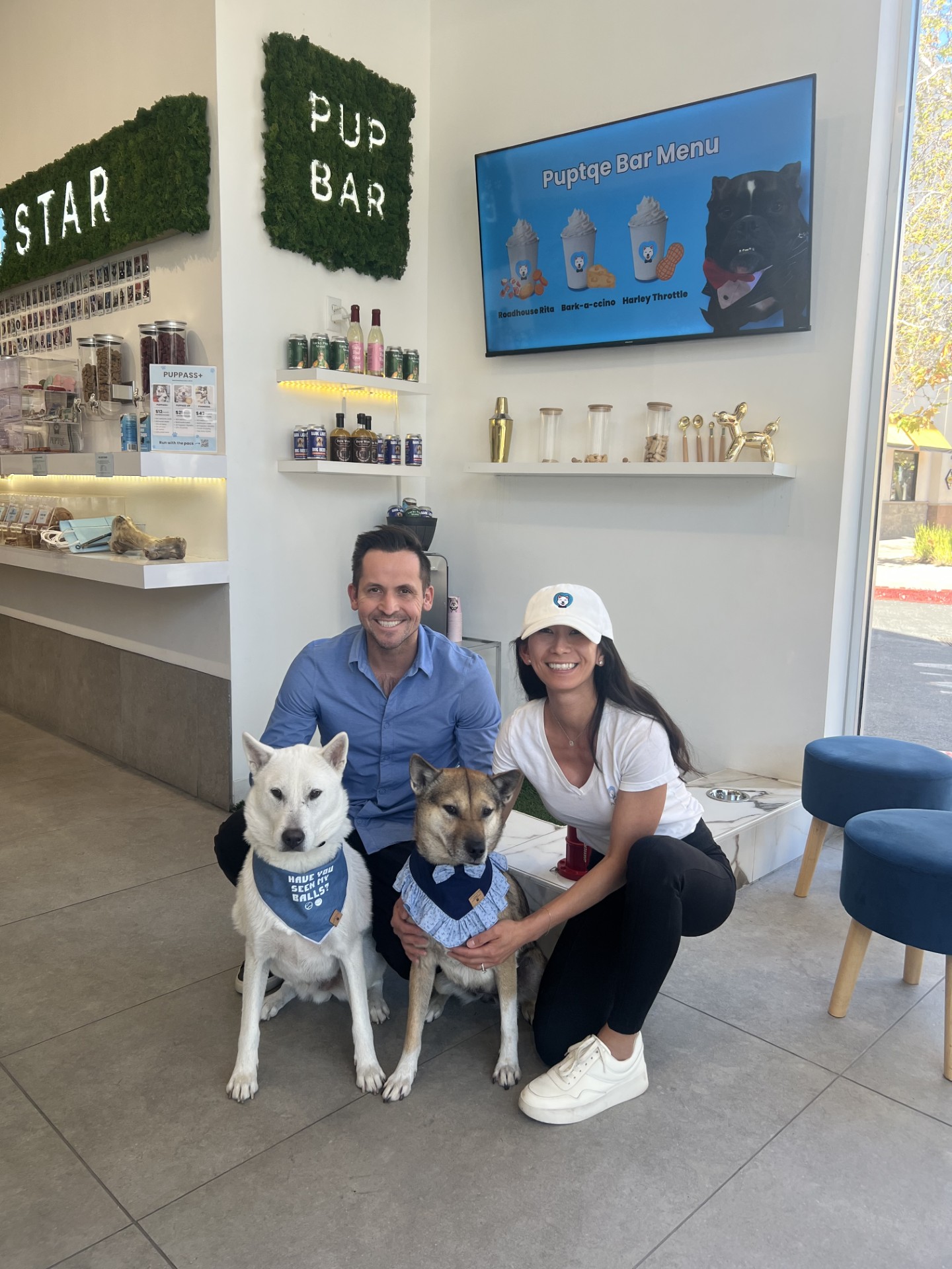 Puptqe founders with dogs inside the Pup Bar