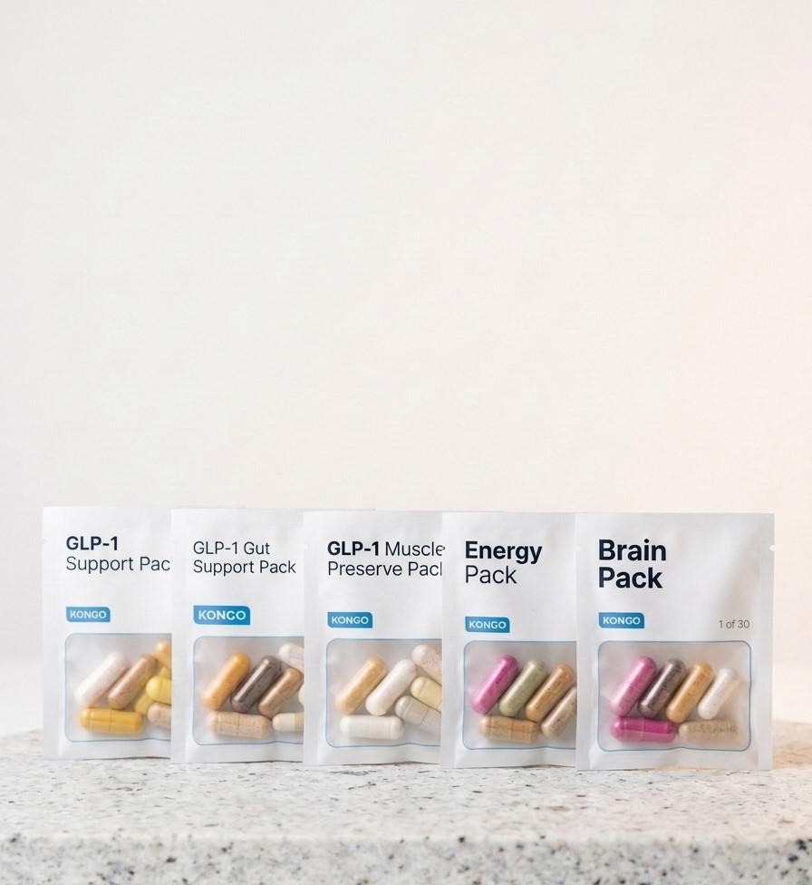 The five Kongo supplement packs lined up on a white granite slab: GLP-1 Support, GLP-1 Gut Support, GLP-1 Muscle Preserve, Energy and Brain.