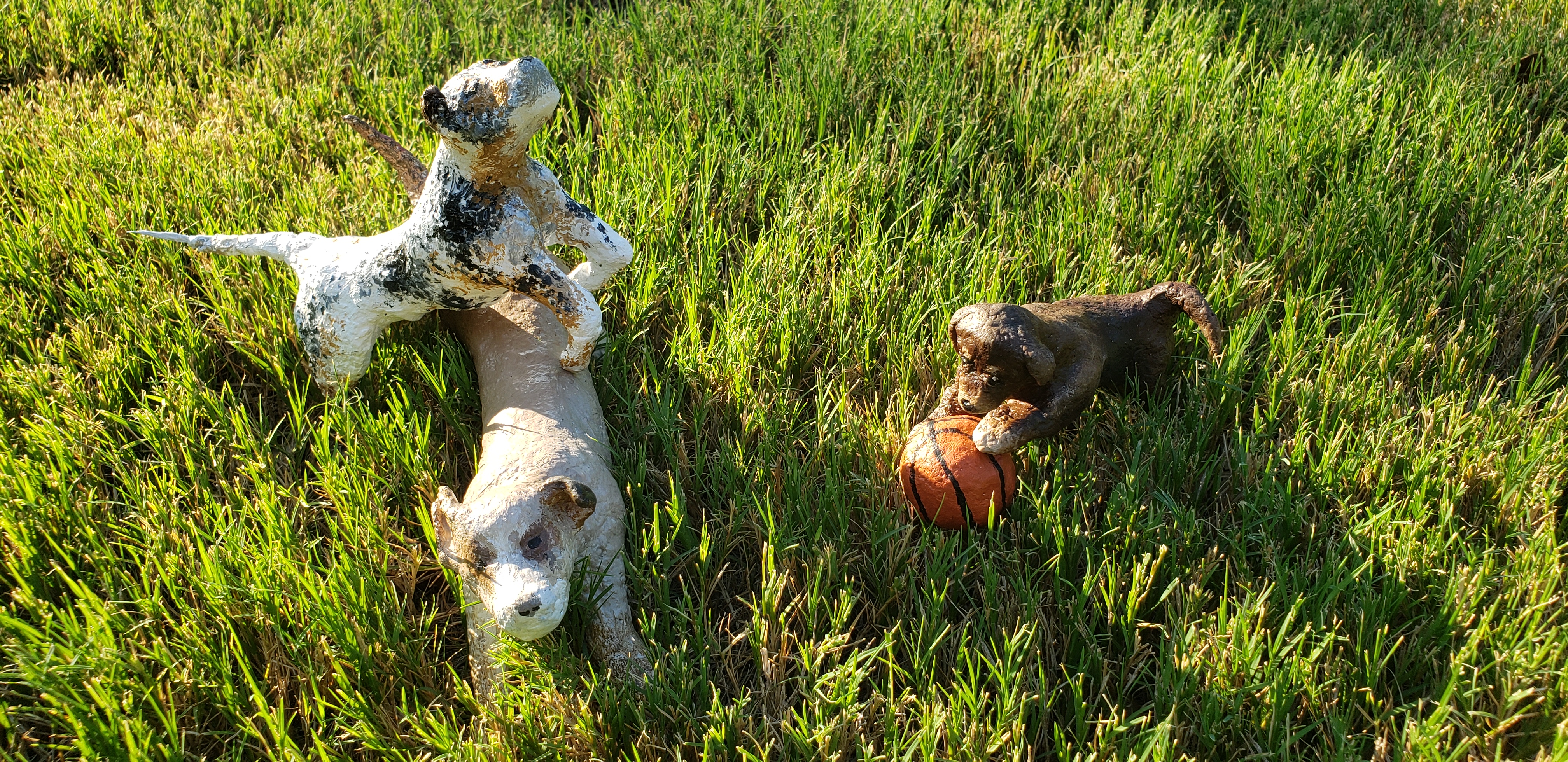 Dog Sculptures on Grass