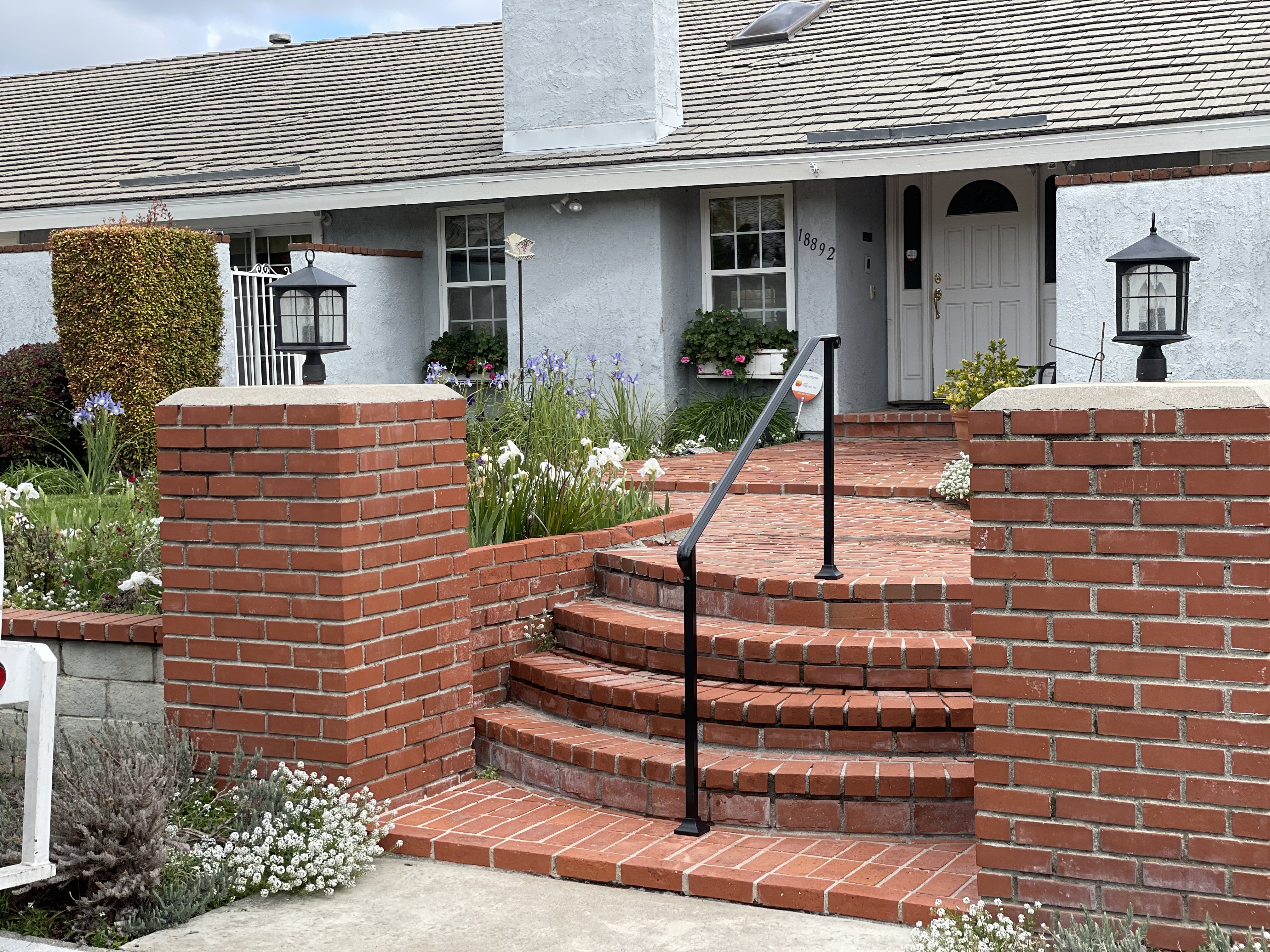 Iron Stair Railing on Curved Brick Steps
