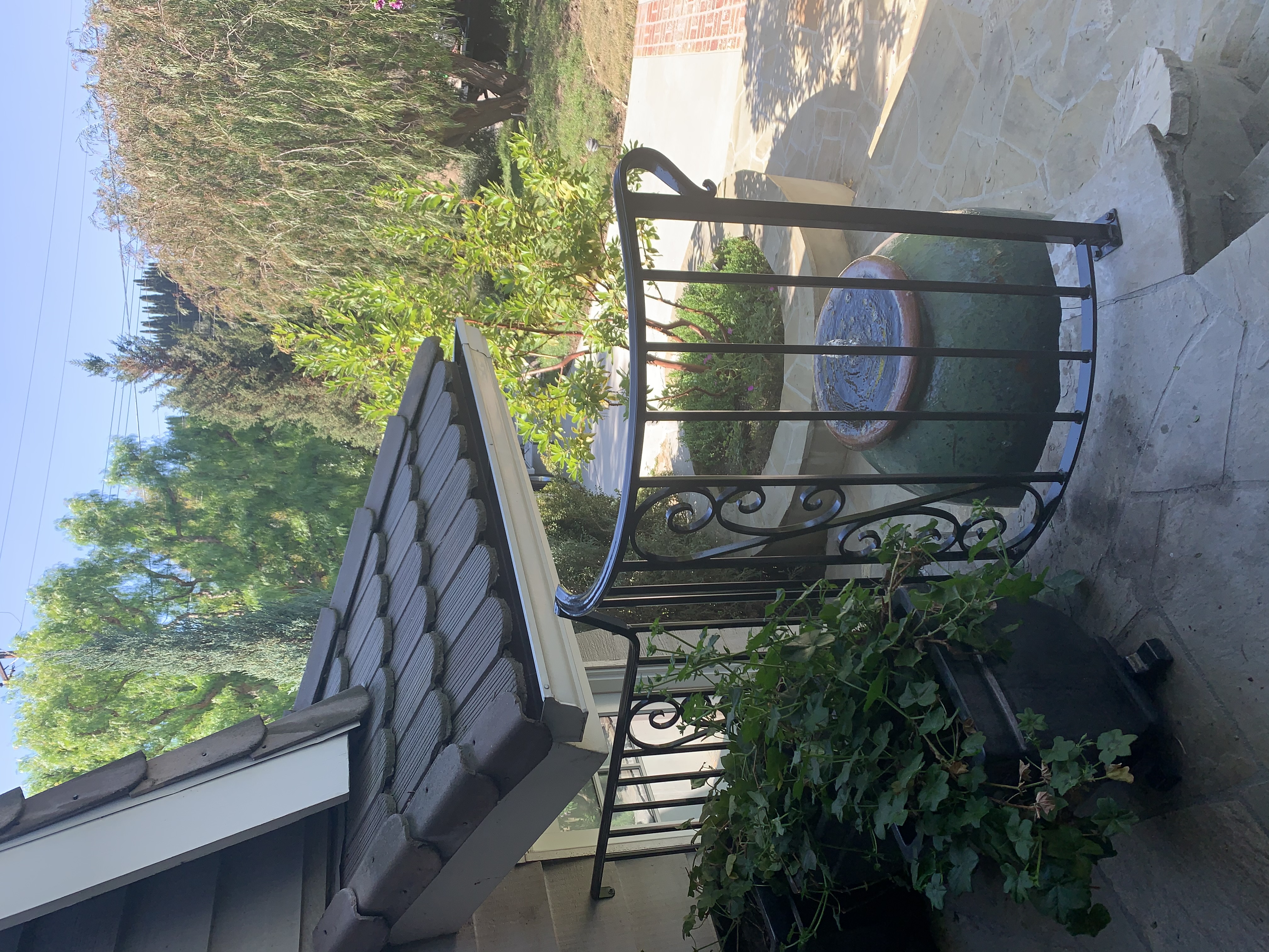 Scrollwork Stair Railing on Brick Porch