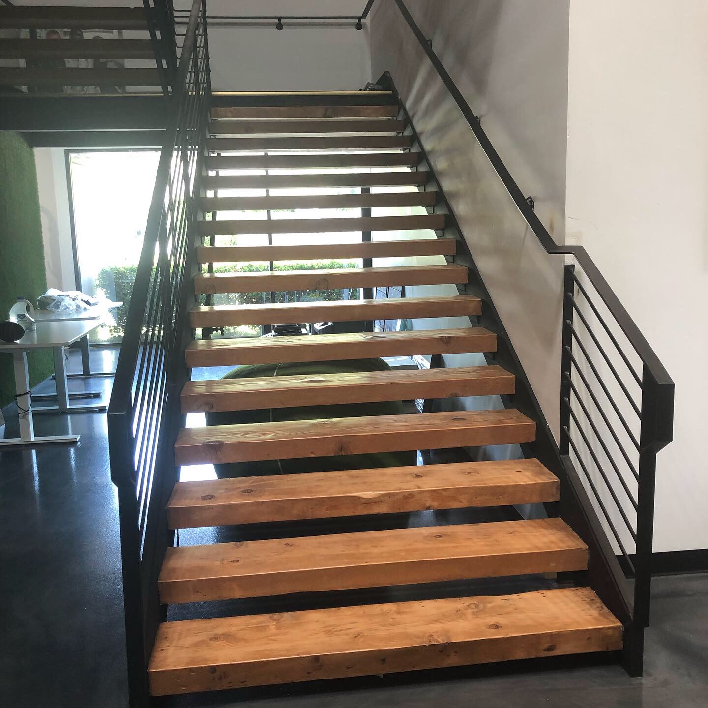 Modern Open-Riser Staircase with Horizontal Iron Railing