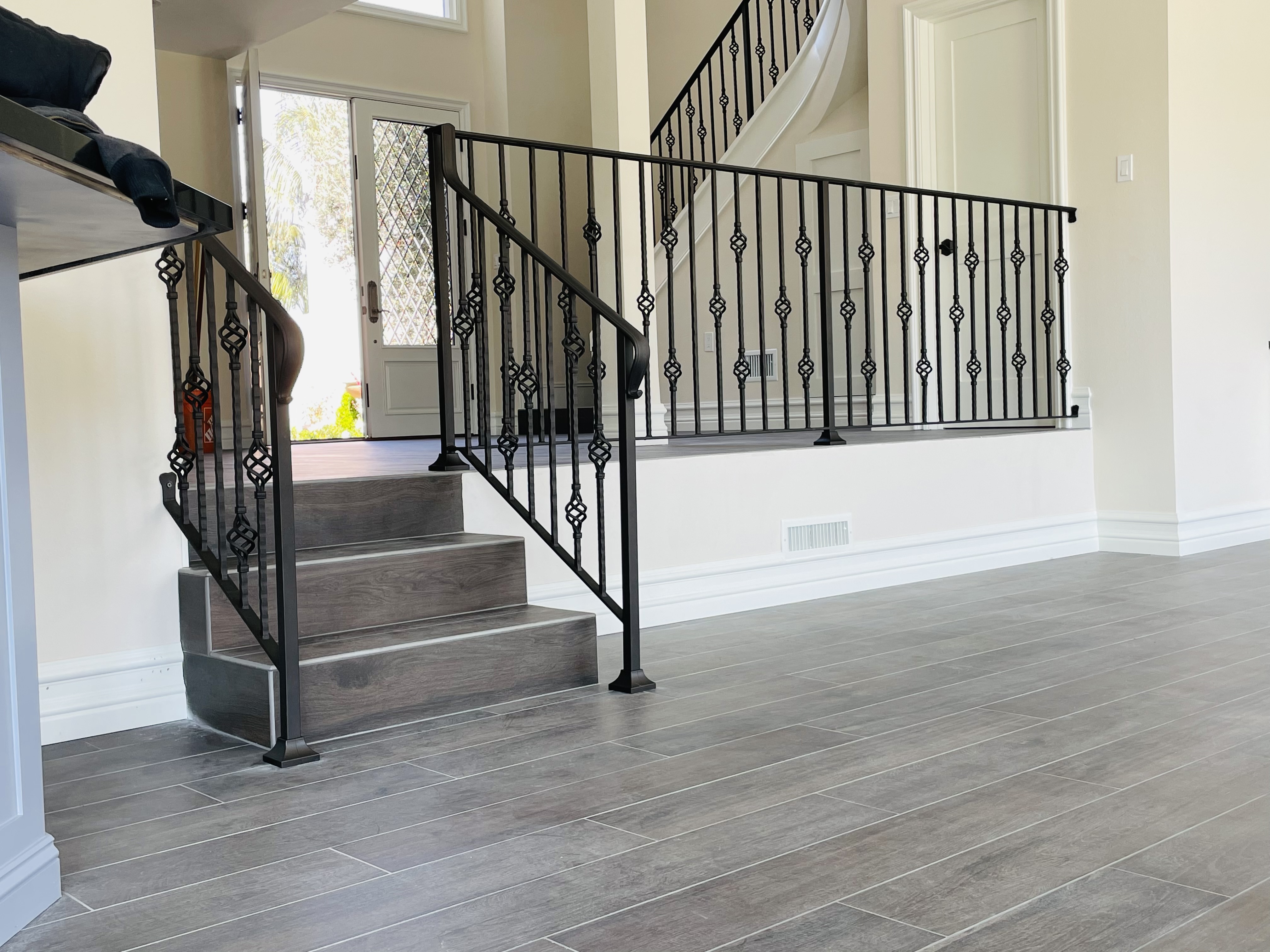Twisted Basket Baluster Stair Railing on Grey Steps