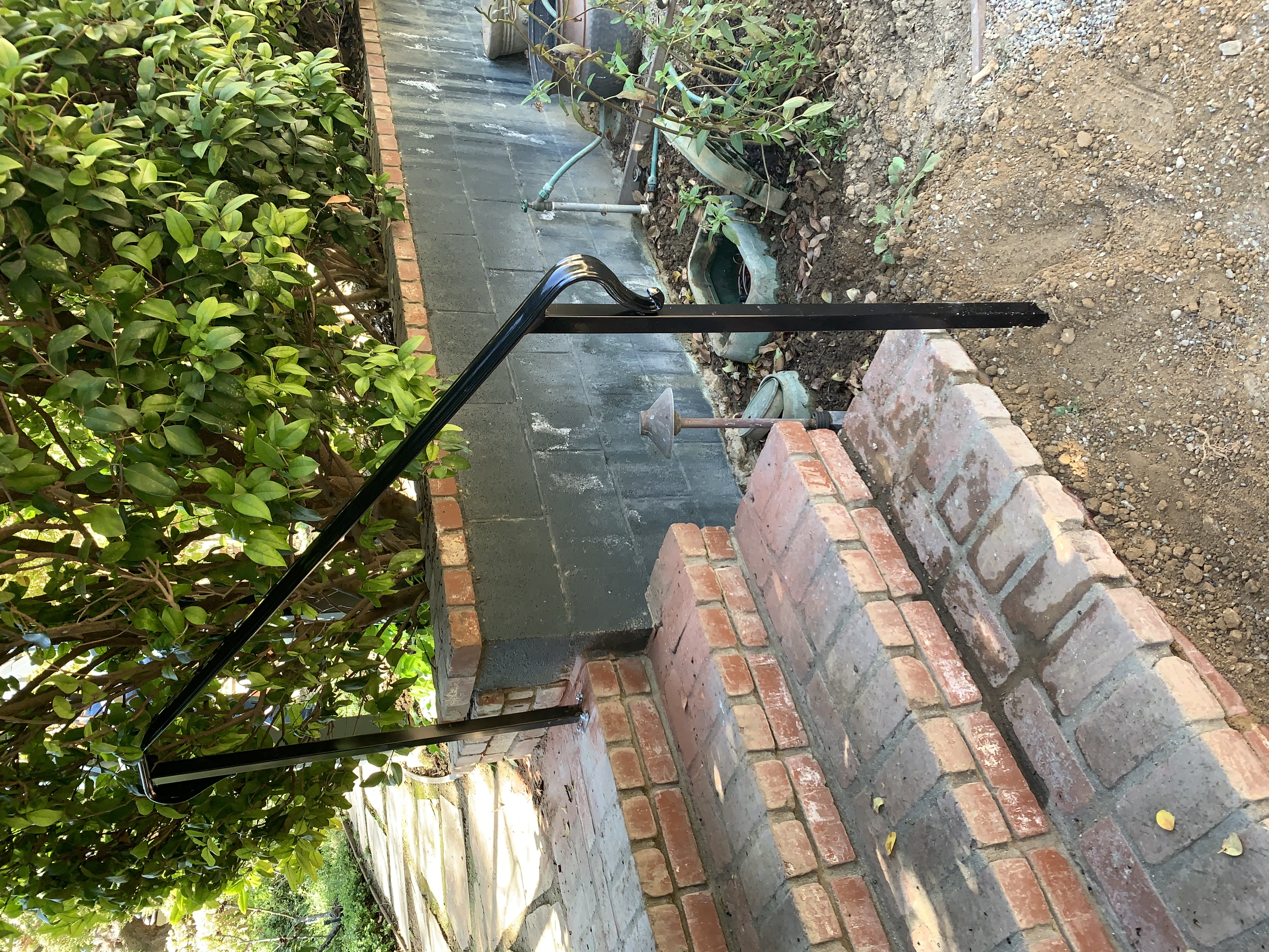 Simple Iron Step Handrail on Brick Steps