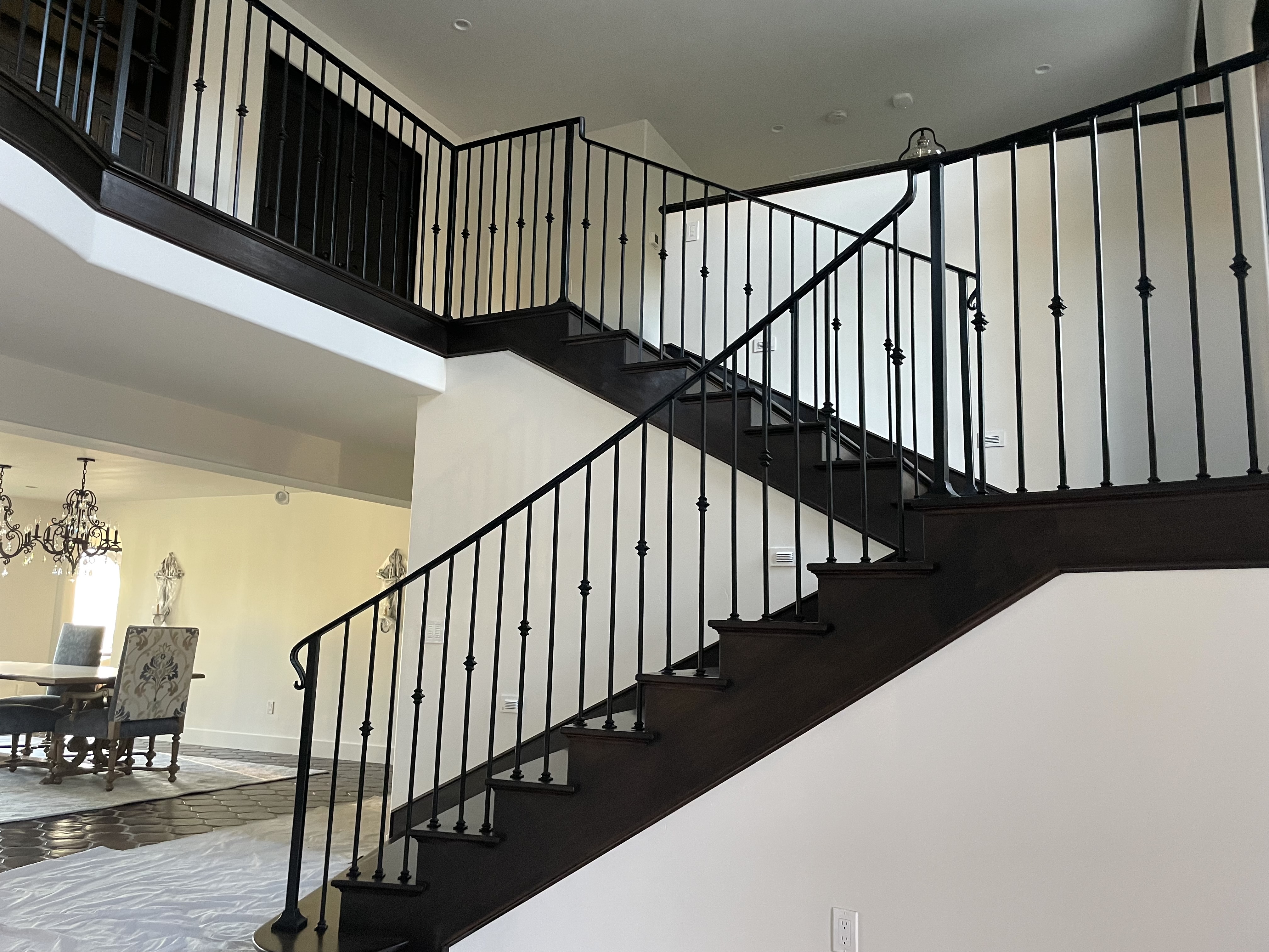 Grand Scrollwork Curved Staircase with Wood Treads