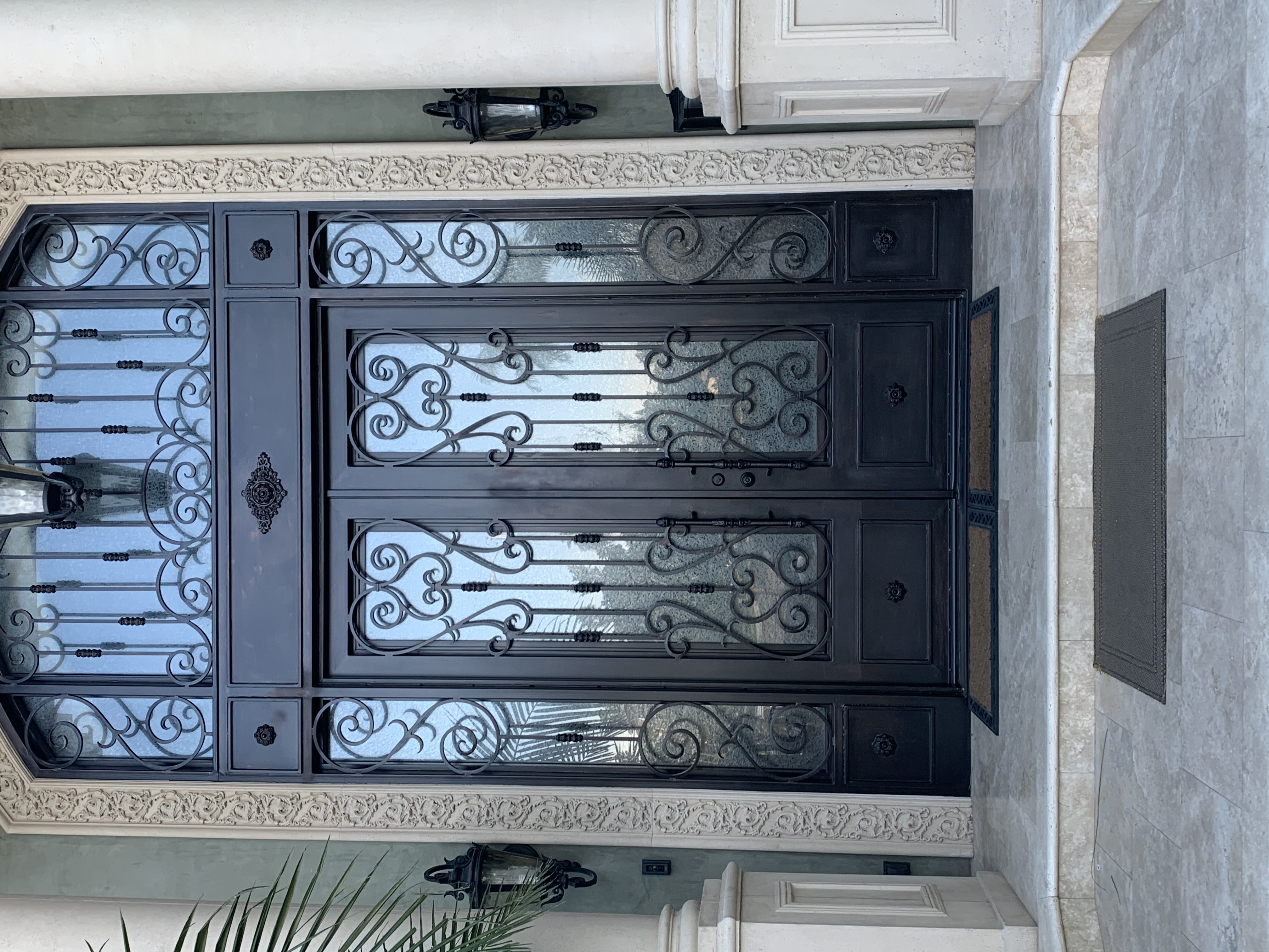 Grand Double Iron Door with Scrollwork Sidelights