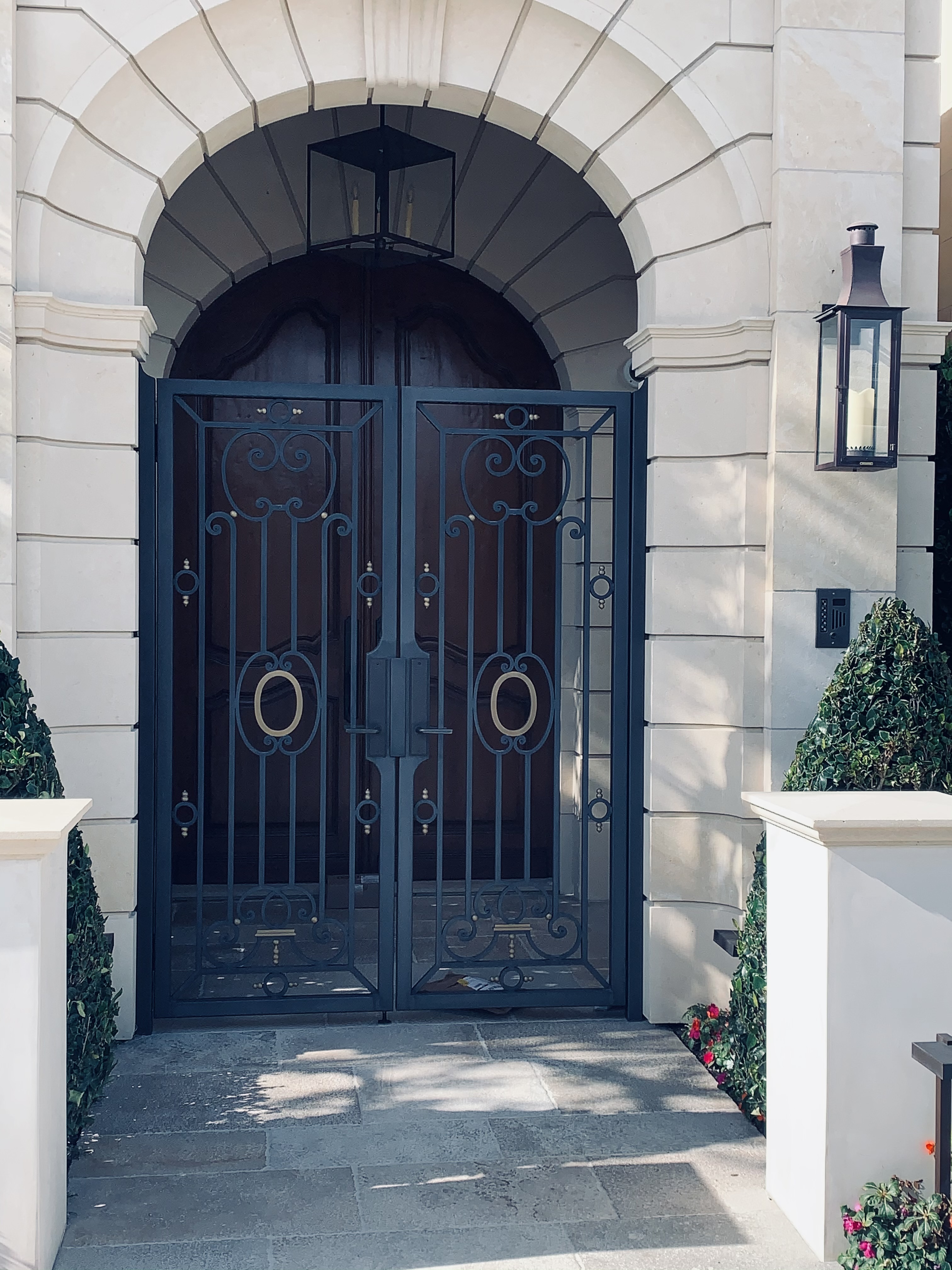 Arched Double Iron Door with Full-Length Glass