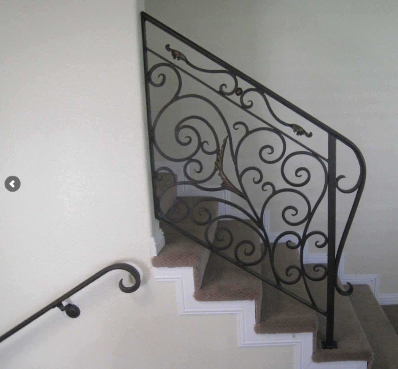 Scrollwork Stair Railing with Gold Leaf Accents