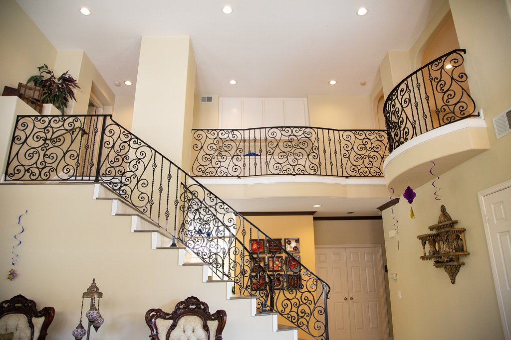 Grand Scrollwork Staircase & Balcony