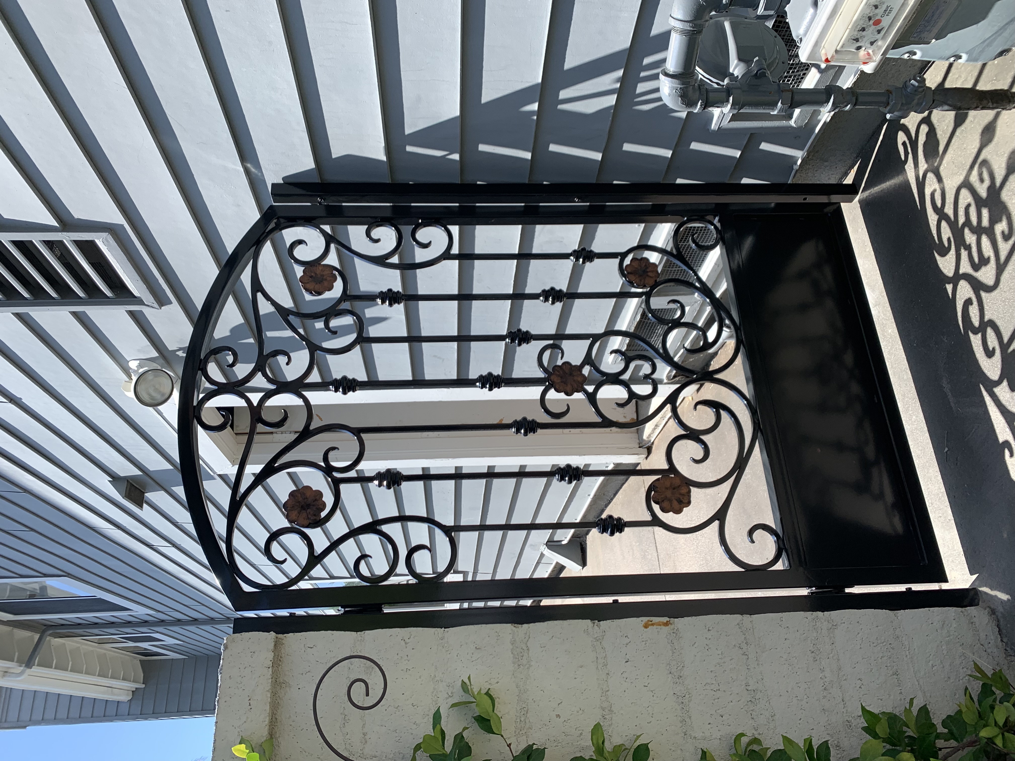 Scrollwork Entry Gate with Bronze Rosettes