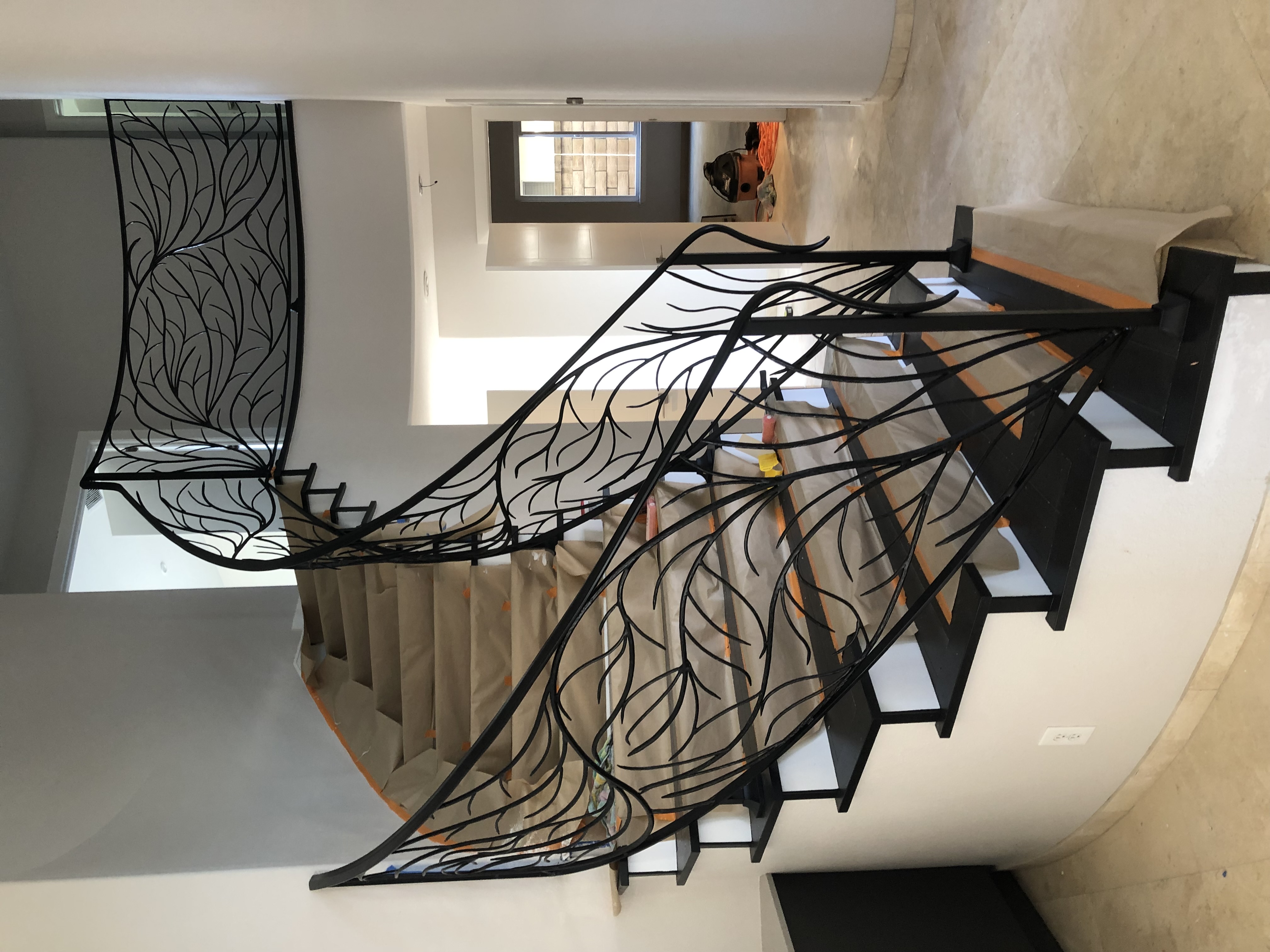 Curved Staircase with Branch Pattern Iron Railing