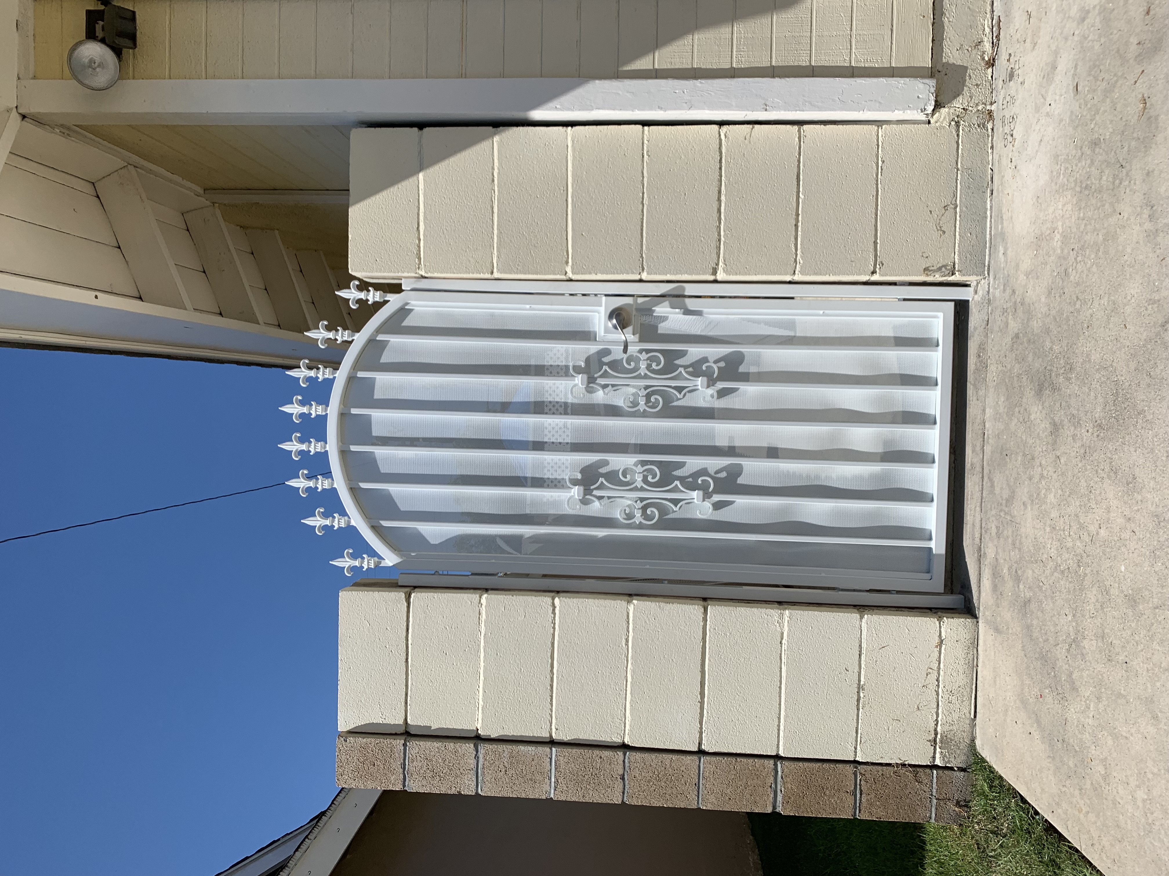 White Fleur-de-Lis Arched Side Gate