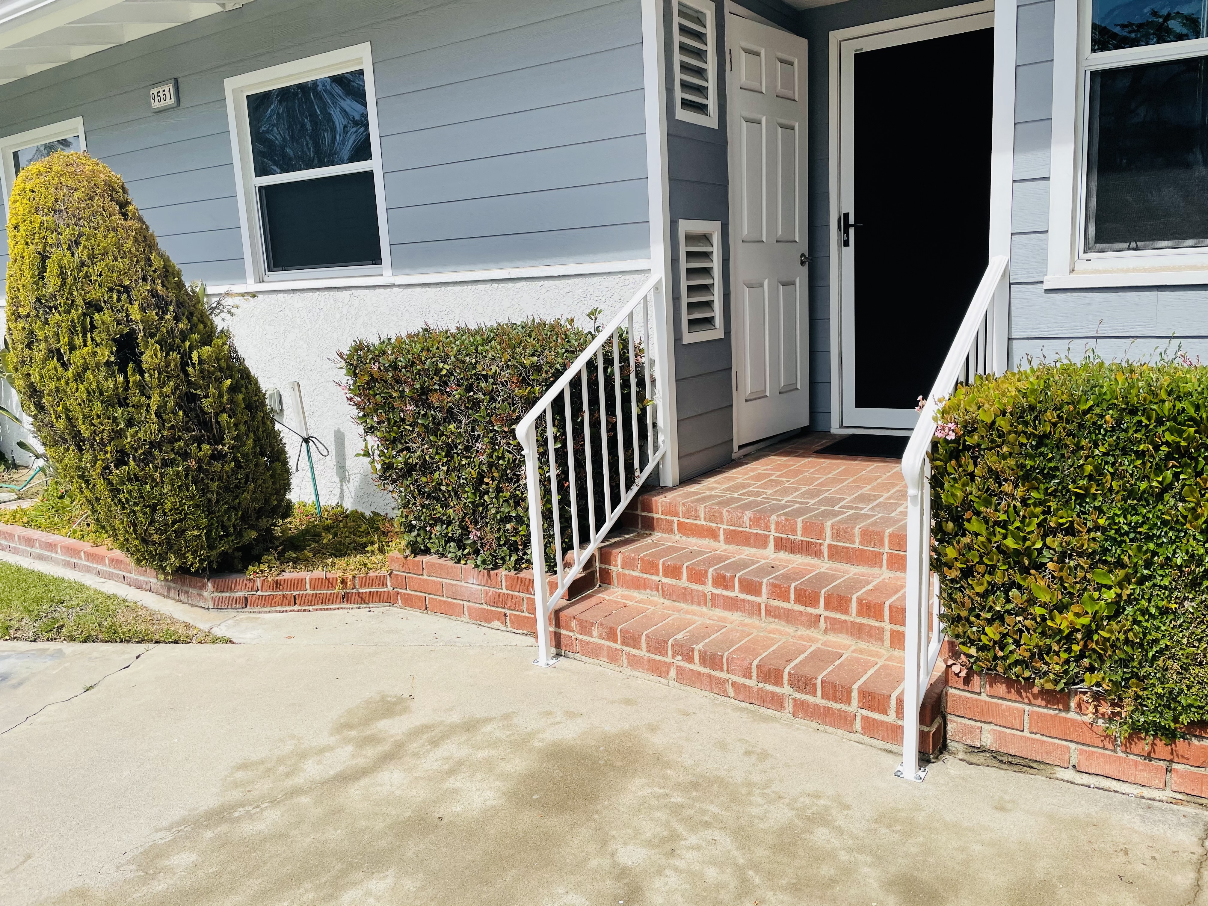 White Stair Railings on Brick Porch Steps