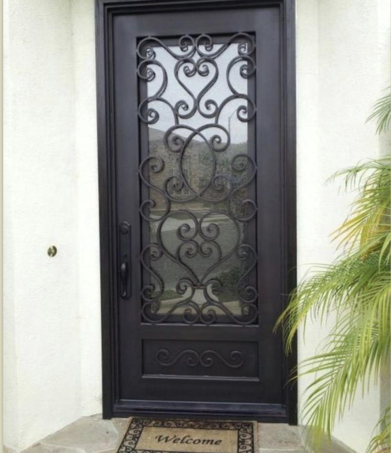 Single Iron Door with Heart Scrollwork Glass
