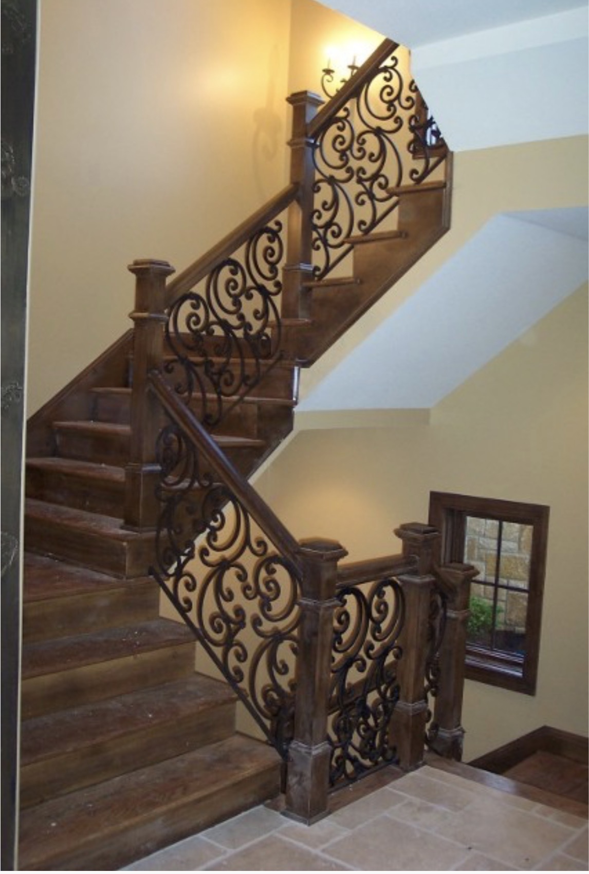 Scrollwork Staircase Railing with Dark Wood Newels