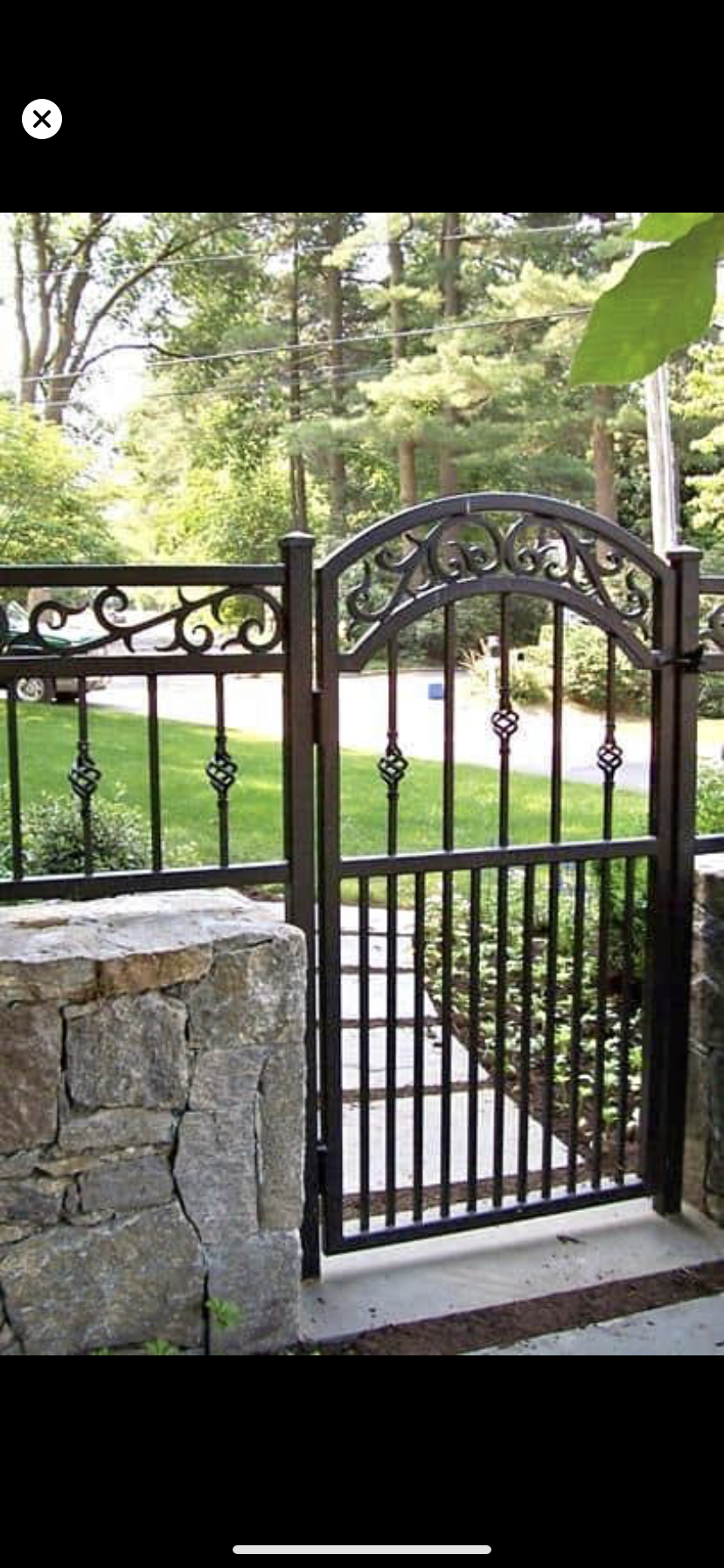 Arched Wood Double Gate with Iron Accents