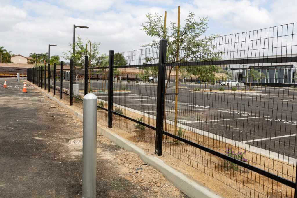 Large Scale Commercial Perimeter Fence & Railing — Crest Steel Facility — commercial iron work by Xtreme Iron Work