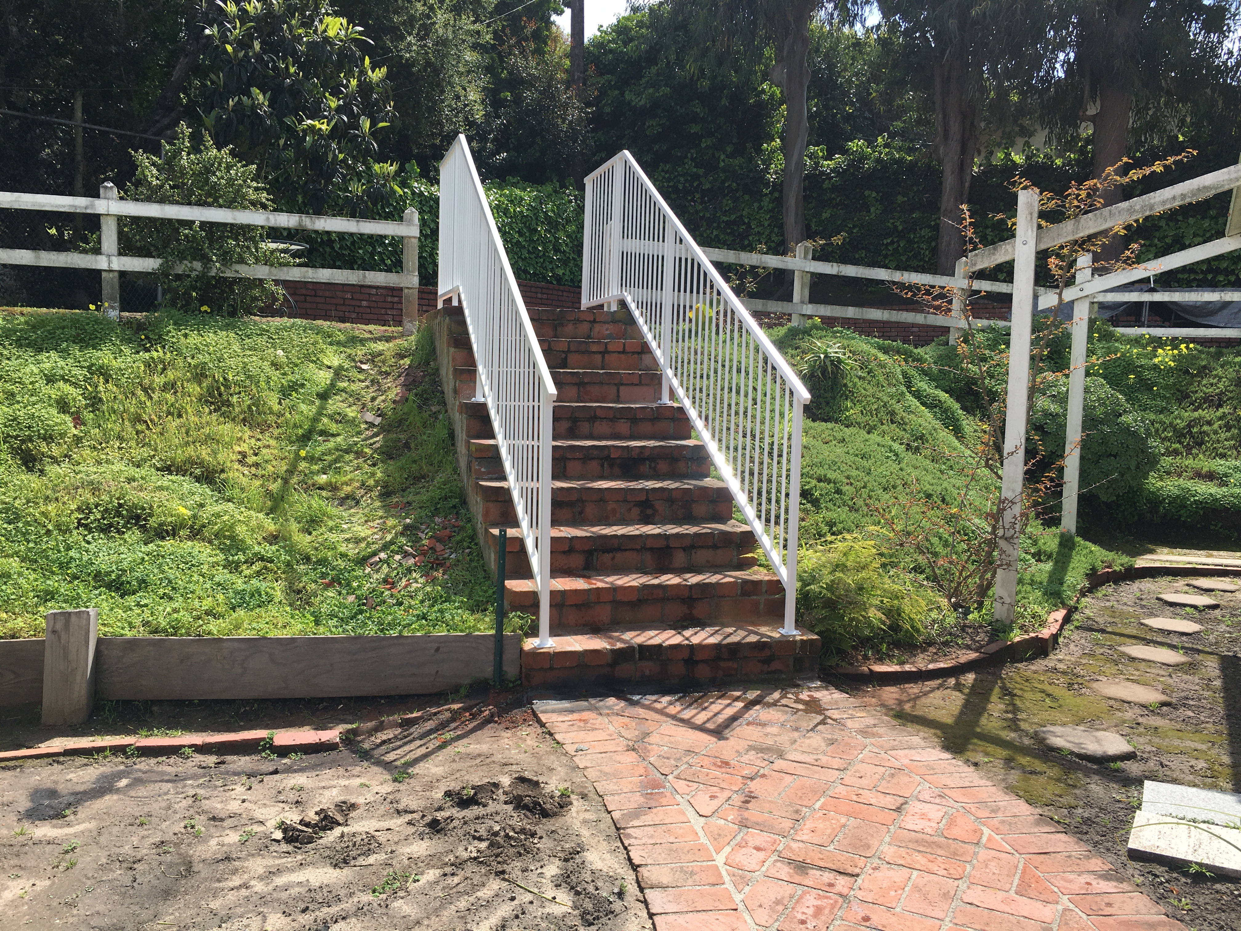 White Double Stair Railing on Brick Steps