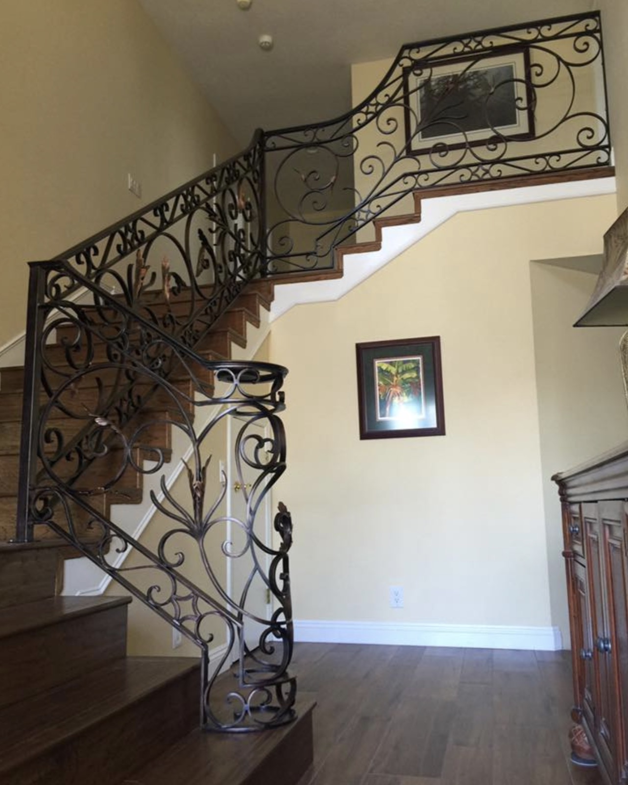 Scrollwork Stair Railing with Gold Leaf Details