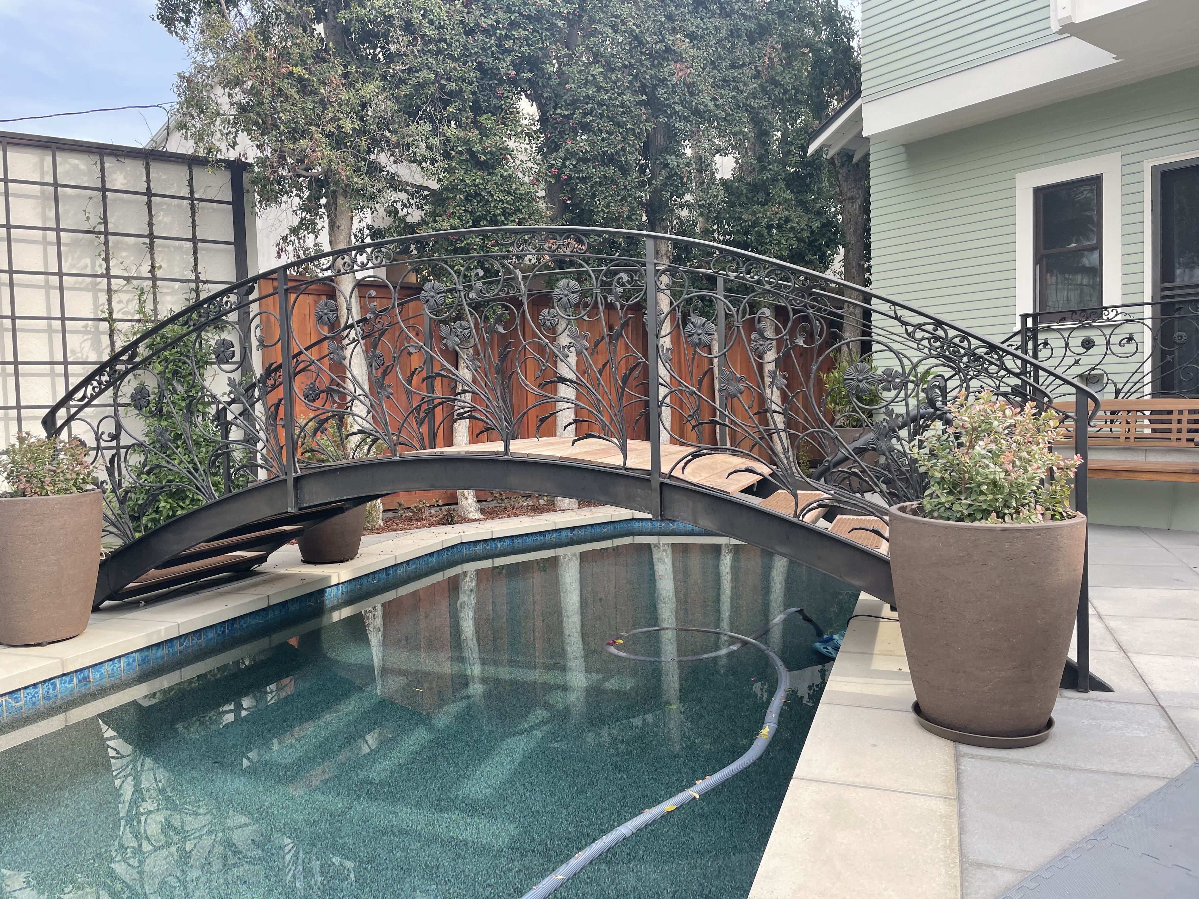 Arched Wrought-Iron Pool Bridge