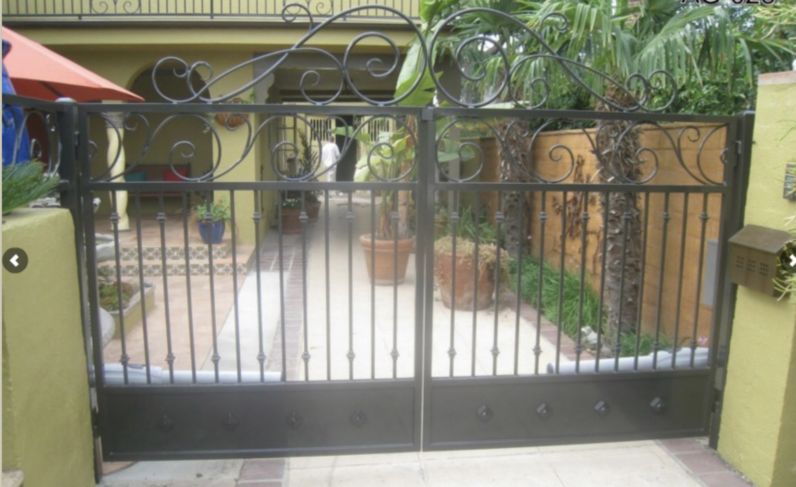 Arched Iron Scrollwork Double Gate