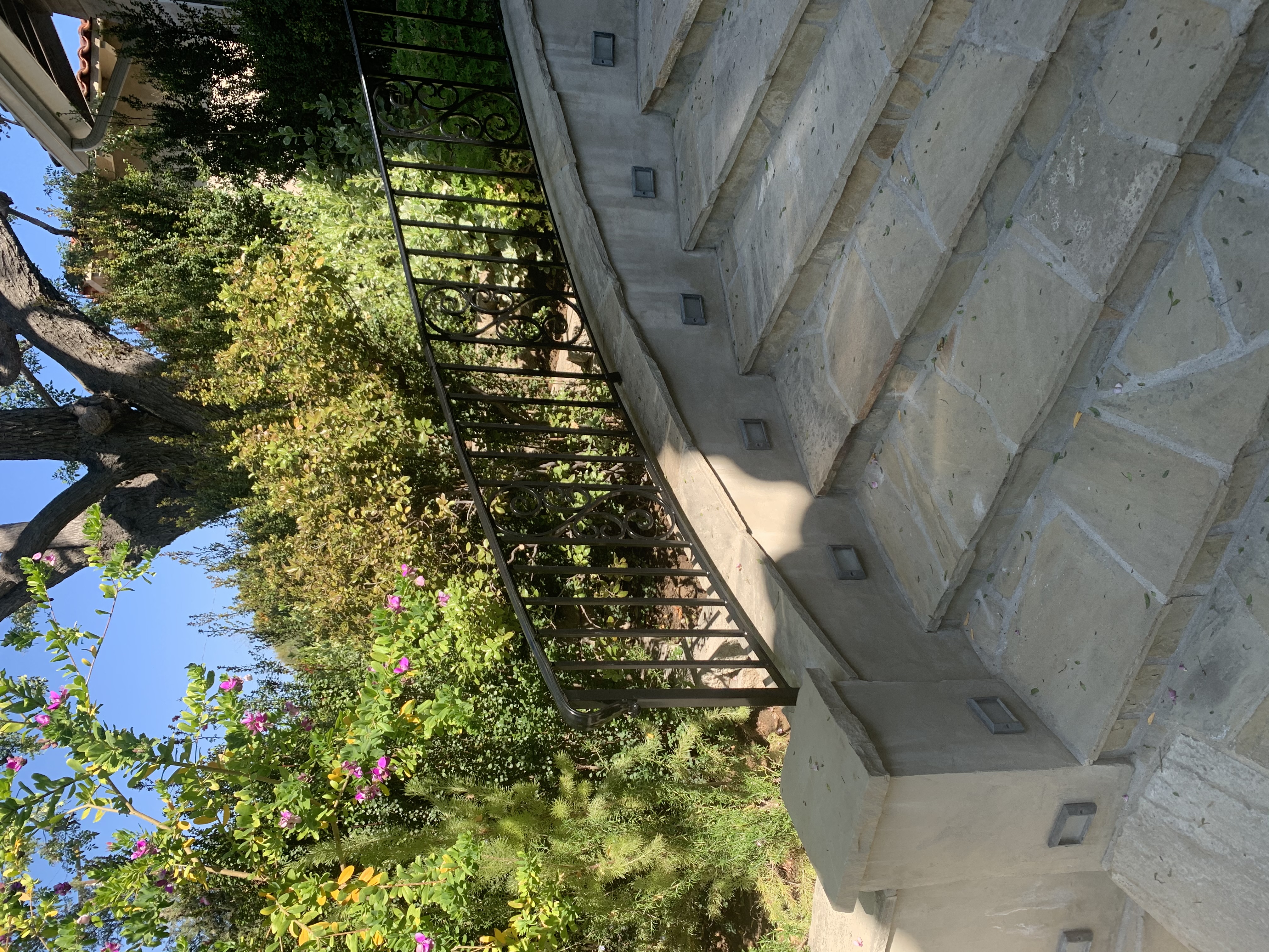 Curved Iron Stair Railing with Scrollwork