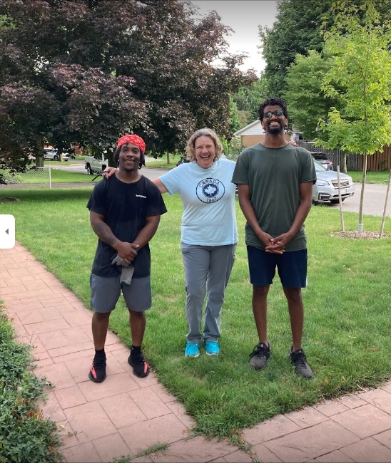 Happy customer with True North Movers crew after a successful move in London, Ontario