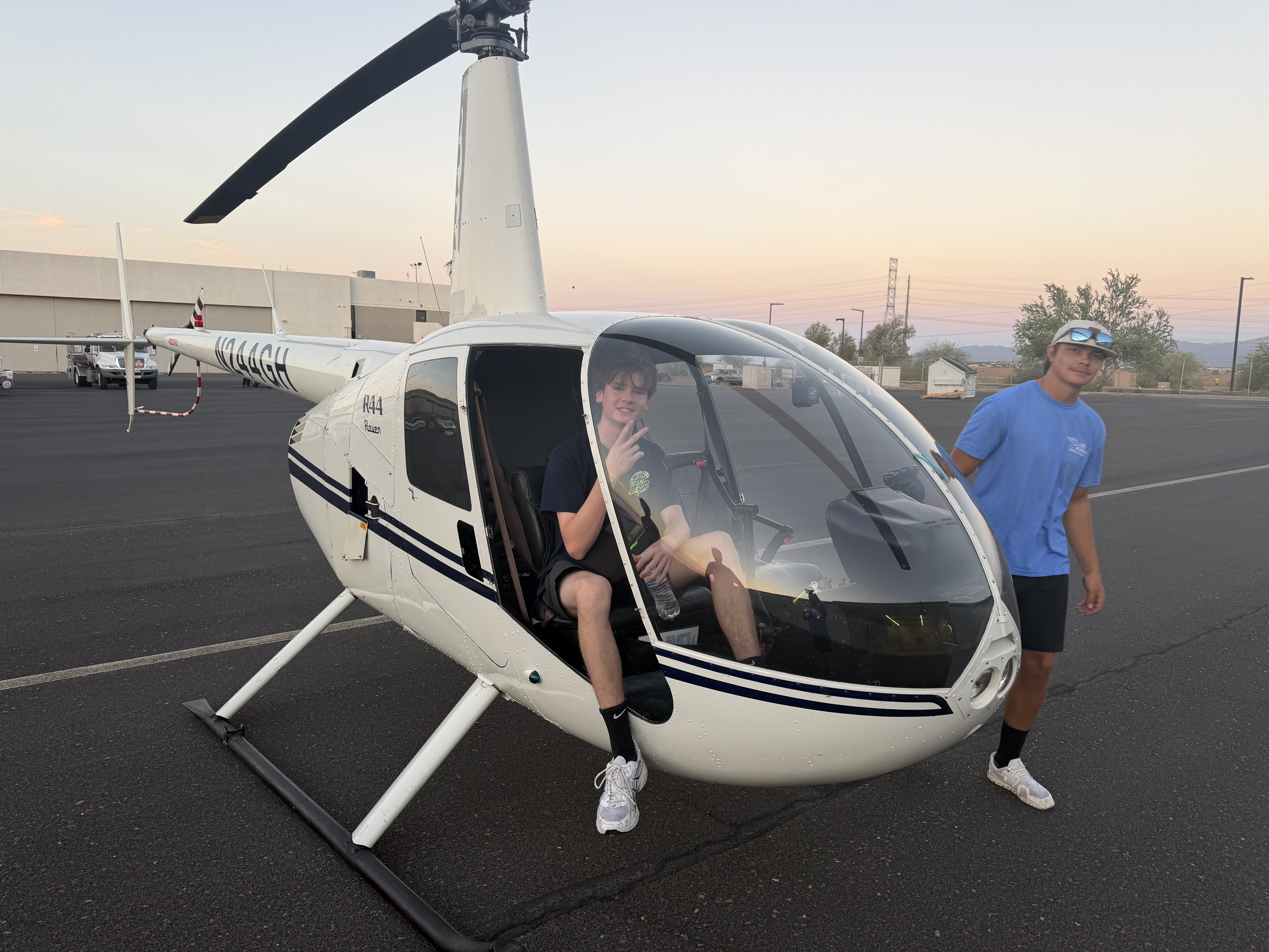 Robinson R44 Raven helicopter on the ramp at sunset