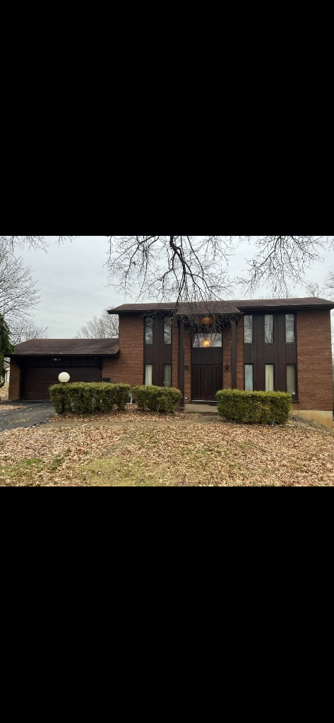 Split-Level Brick — Before Roof Replacement