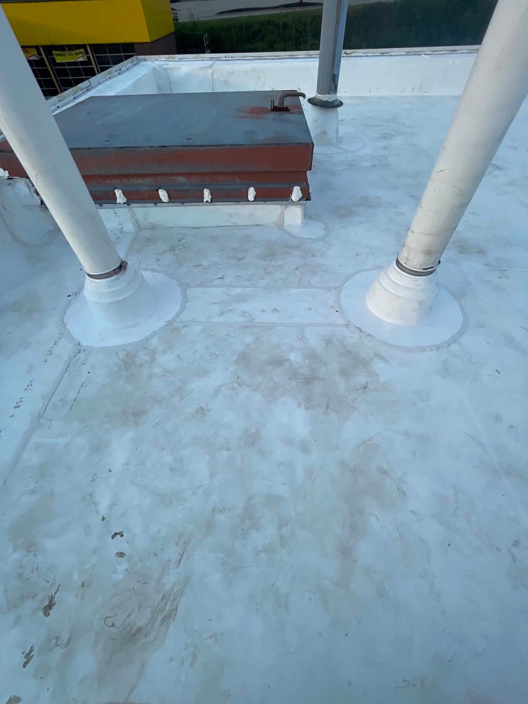 Completed commercial TPO flat roof replacement by TNT Roofing